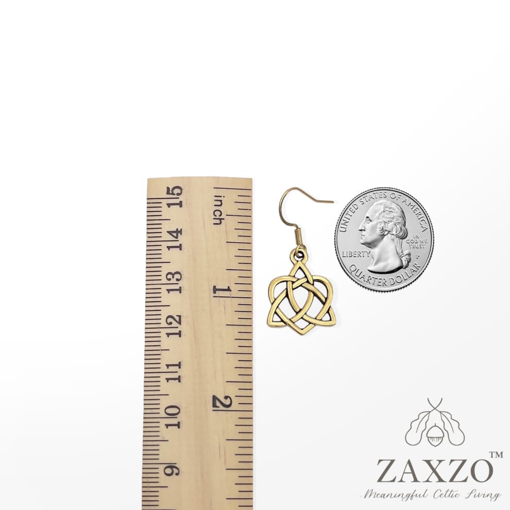 Celtic small gold sister knot French wire earring between ruler and quarter
