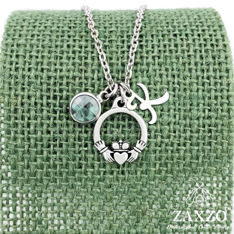 Personalized silver Irish Claddagh necklace with April birthstone and letter