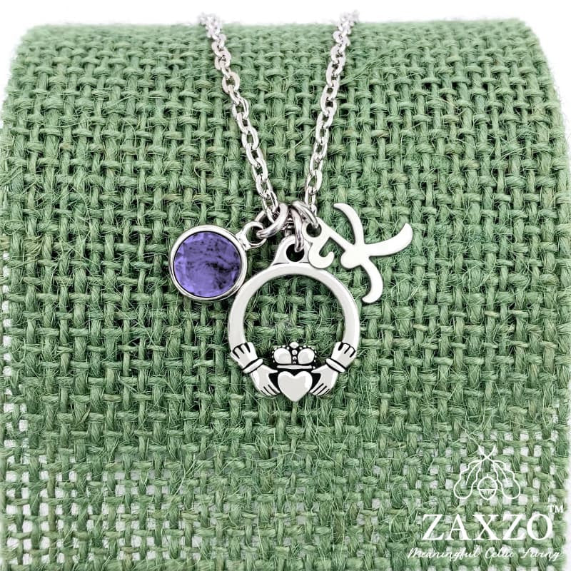 Personalized silver Irish Claddagh necklace with February birthstone and letter