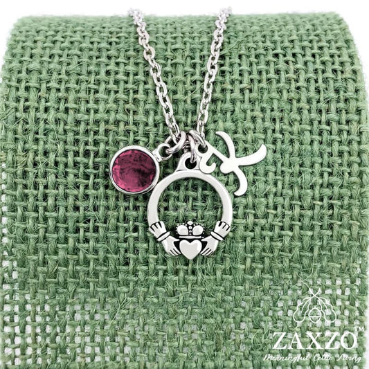 Personalized silver Irish Claddagh necklace with January birthstone and letter