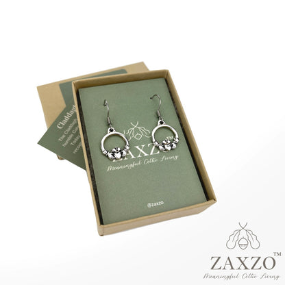 Sterling French wire silver Claddagh earrings in open gift box with card explaining the meaning.
