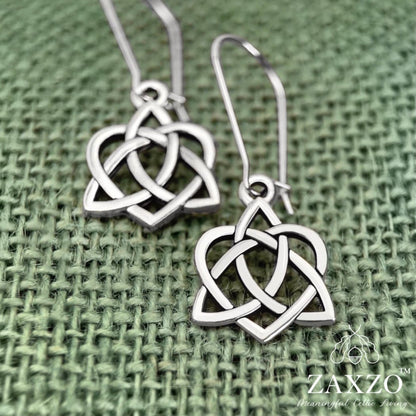 Silver sister knot earring on Sterling kidney wire earrings shown on green burlap