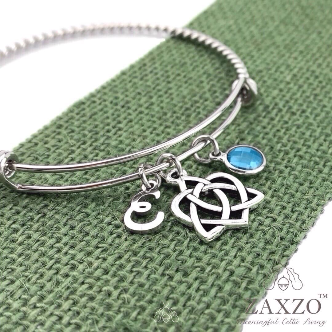 Sister knot bangle with December birthstone and choice of letter.