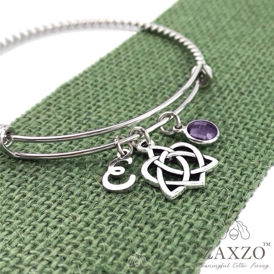 Sister knot bangle with February birthstone and choice of letter.