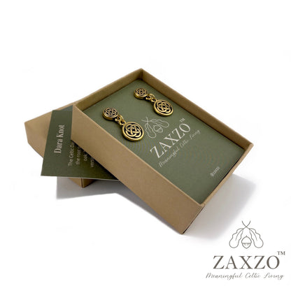 Platinum post small gold Dara knot earrings in open gift box with card explaining the meaning.