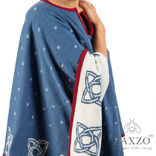 America poncho in denim blue with winter white contrast pattern and red trim shown from side