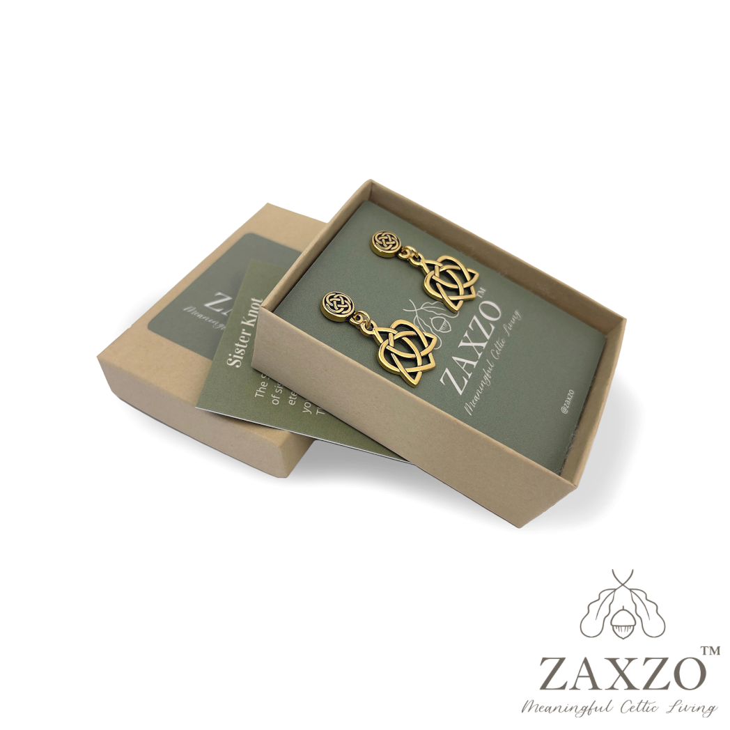 Platinum post gold sister knot earrings in open gift box with card explaining the meaning.
