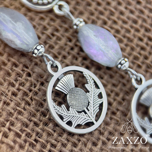 Silver Scottish thistle earrings with purple Czech beads on round platinum ear post close up