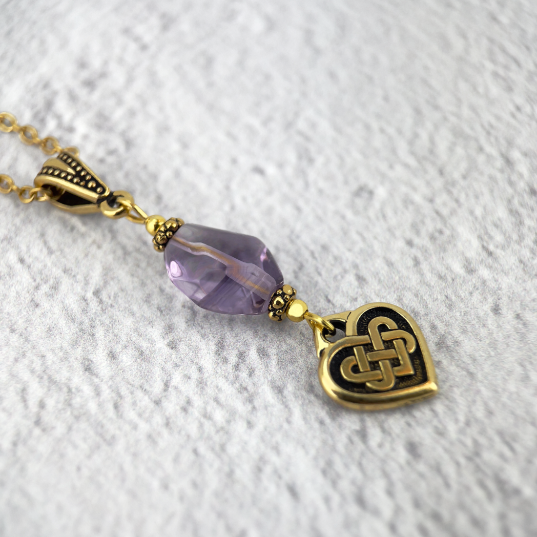 Gold Celtic everlasting love knot necklace on bail with lavender amethyst