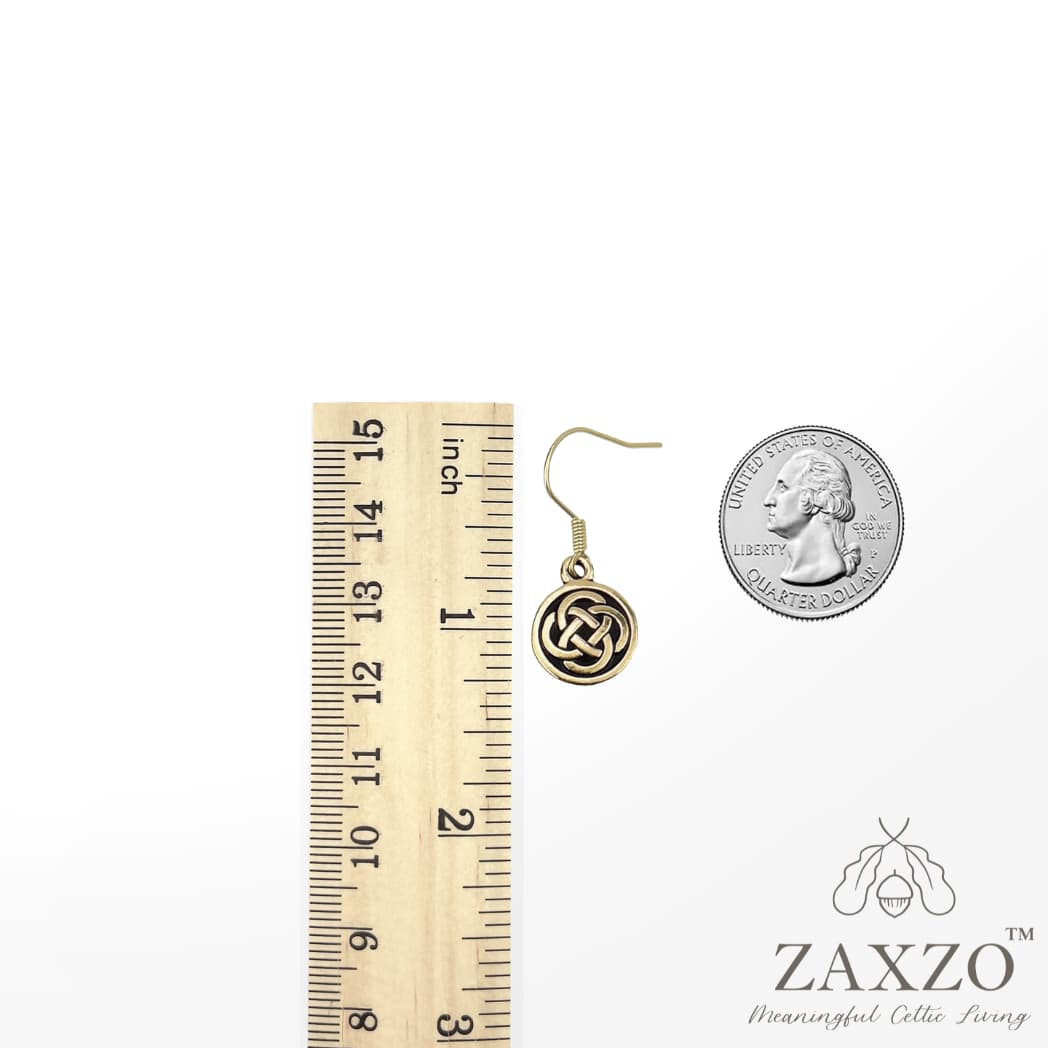 Gold small Dara knot earrings on gold filled French ear wire shown in between ruler and quarter 