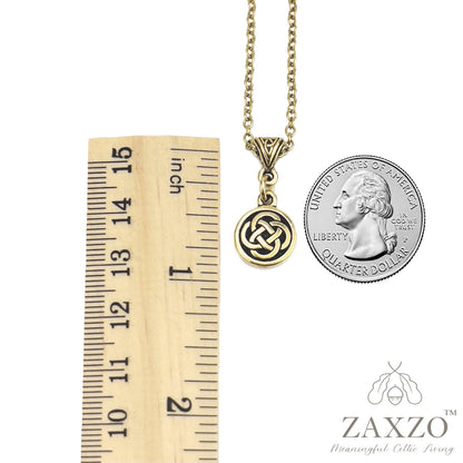 Celtic small gold dara knot necklace between ruler and quarter