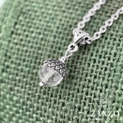 Celtic silver acorn with silver cap on clear faceted crystal quartz