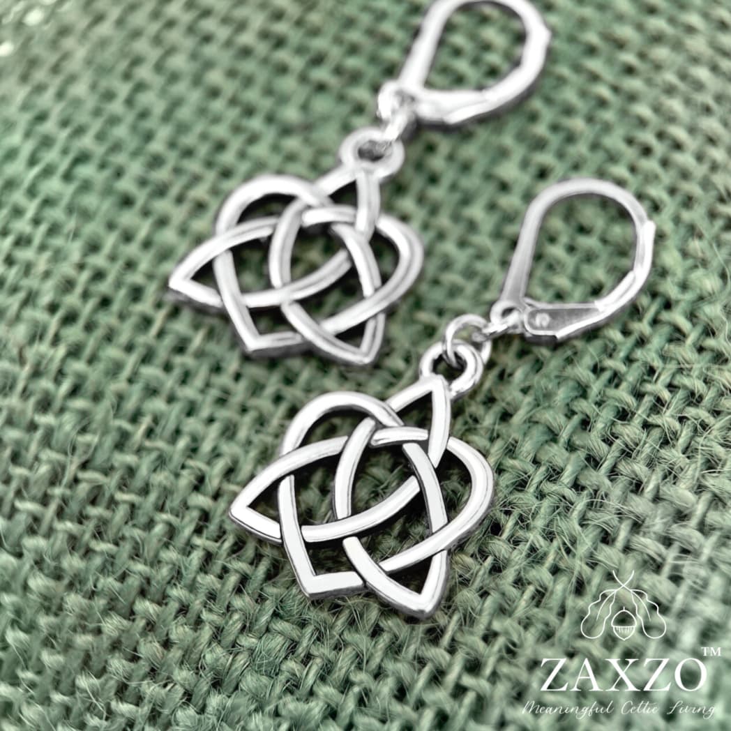 Silver celtic sister knot earring on sterling lever back ear wire shown on sage green burlap.