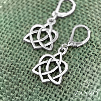 Silver celtic sister knot earring on sterling lever back ear wire shown on sage green burlap.