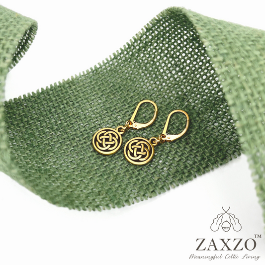 Small Celtic gold Dara knot earrings with gold filled lever back shown on green burlap ribon