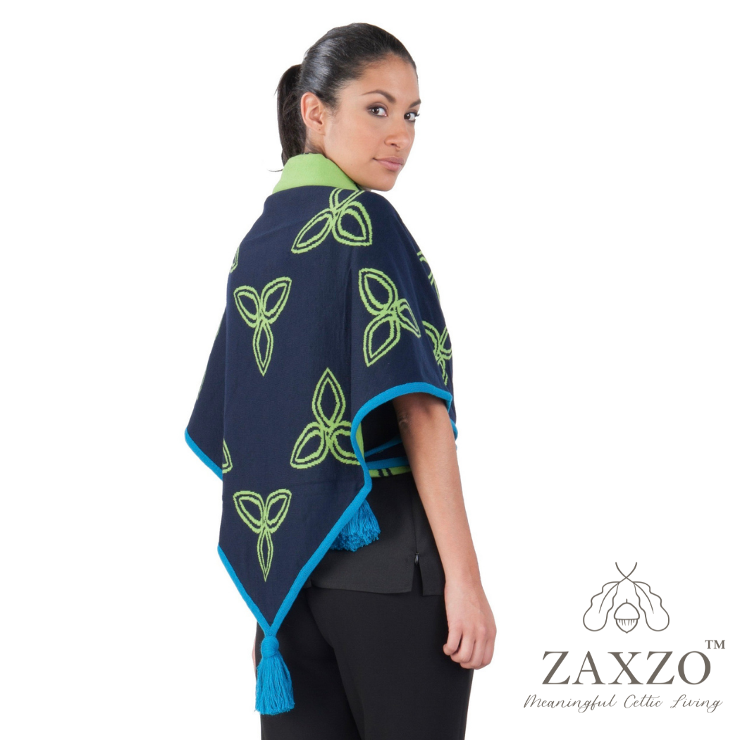 Woman wearing navy triangular wrap with contrast lime Celtic knot shown from side