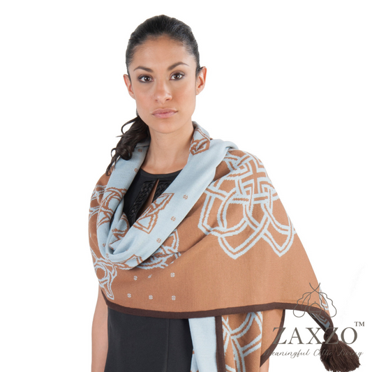 Woman wearing camel scarf and contrast pale blue flower wrap